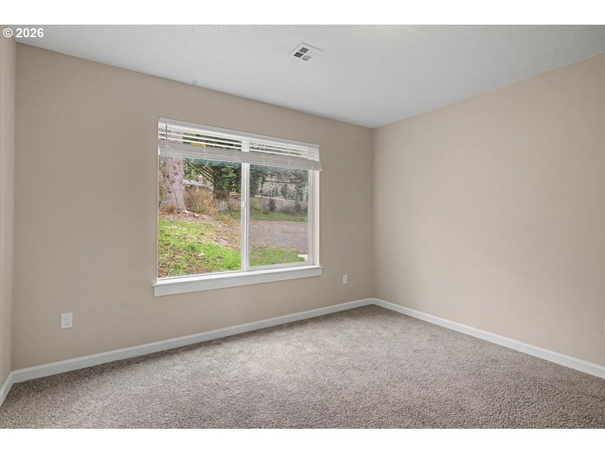 9 North Moolack Way Otis, OR 97368 - Photo 22 of 38 an empty room with windows