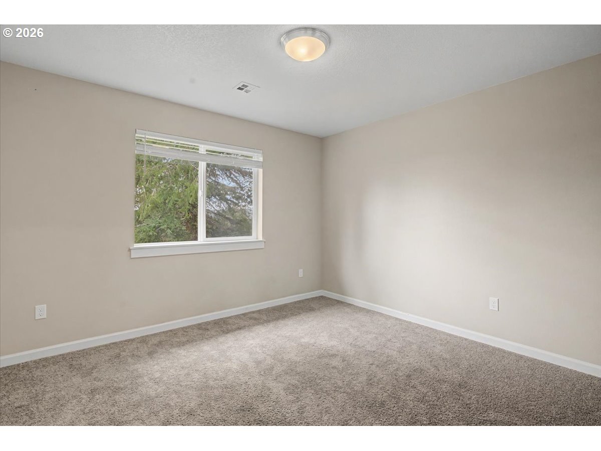 9 North Moolack Way Otis, OR 97368 - Photo 26 of 38 an empty room with windows