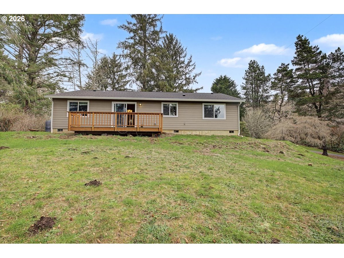 9 North Moolack Way Otis, OR 97368 - Photo 36 of 38 a view of a house with yard and tree in it