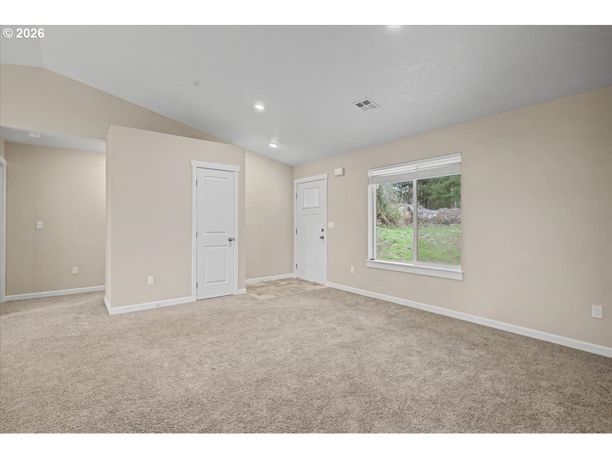 9 North Moolack Way Otis, OR 97368 - Photo 5 of 38 a view of an empty room with a window