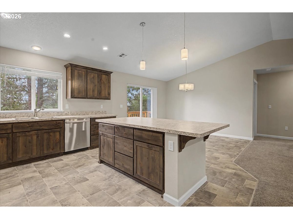9 North Moolack Way Otis, OR 97368 - Photo 6 of 38 a kitchen with a stove a sink and a refrigerator