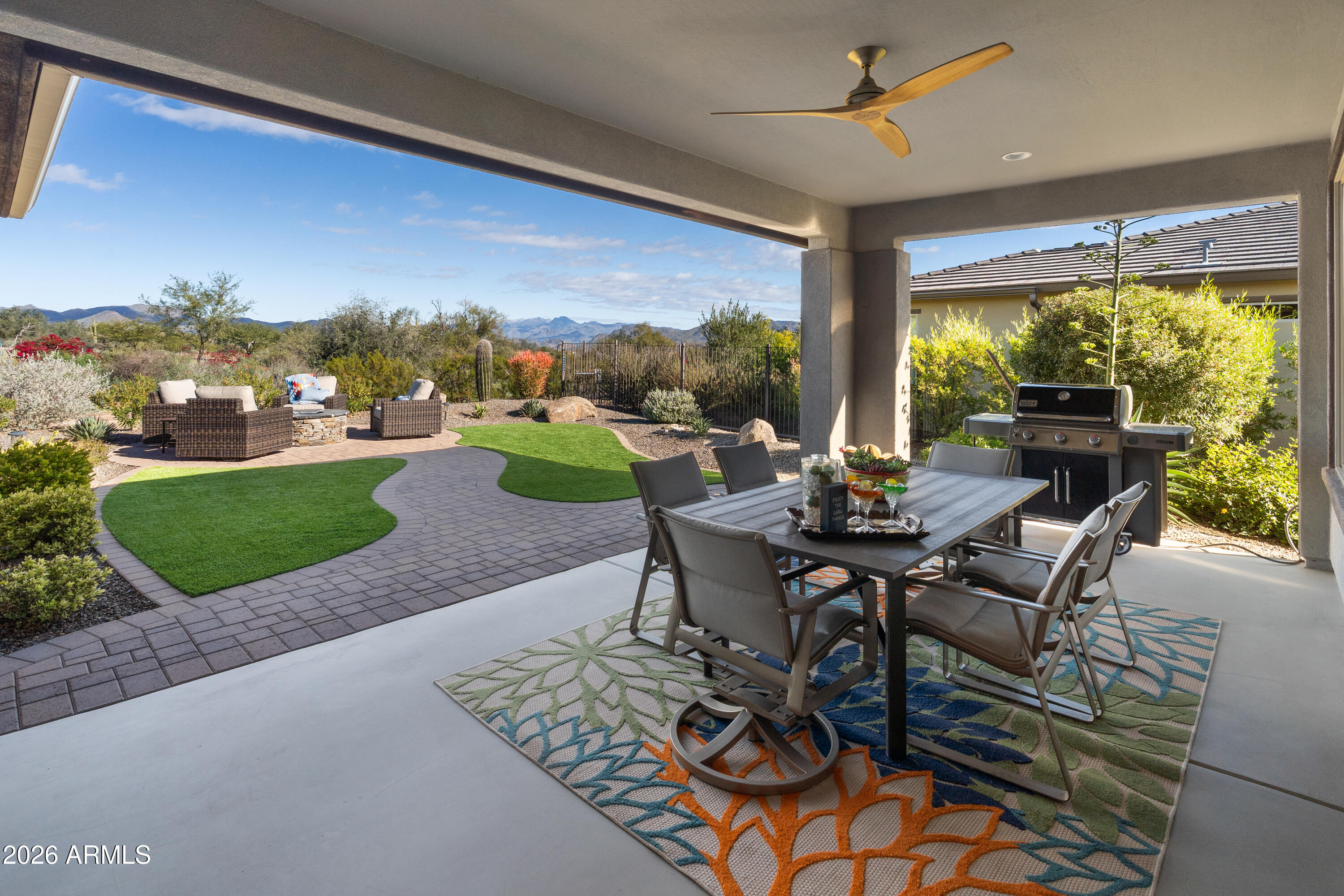 17840 East Paria Canyon Drive Rio Verde, AZ 85263 - Photo 10 of 10 a view of a patio with dining table and chairs