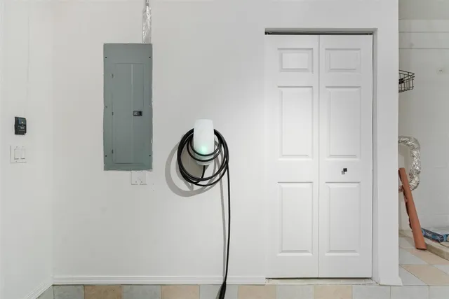 a bathroom with a granite countertop shower and a sink