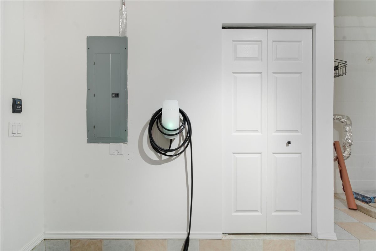 839 West 14th Place Chicago, IL 60608 - Photo 12 of 14 a bathroom with a granite countertop shower and a sink