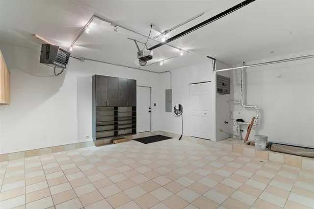 a view of a livingroom with a chair and a ceiling fan