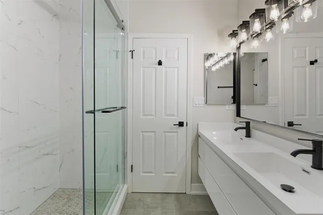a bathroom with a sink and mirror