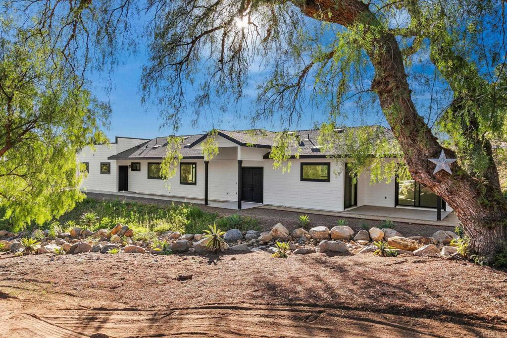 15176 Vali Hai Road Poway, CA 92064 - Photo 11 of 19 a front view of a house with a yard