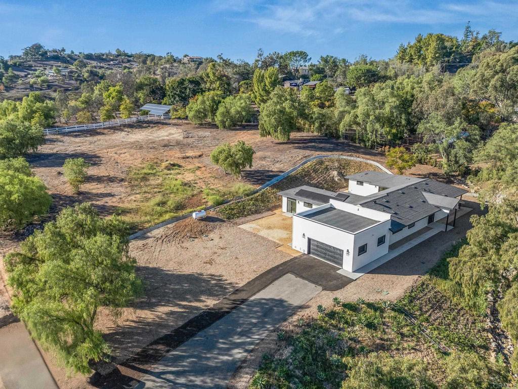 15176 Vali Hai Road Poway, CA 92064 - Photo 13 of 19 an aerial view of a house with a yard