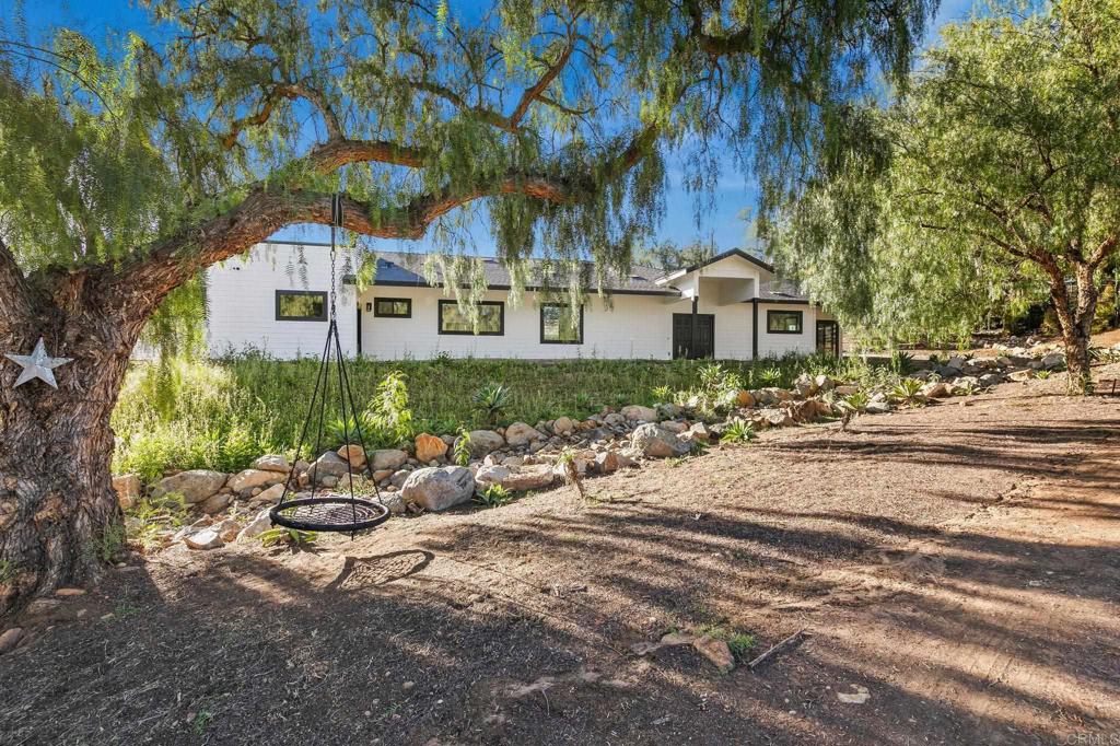 15176 Vali Hai Road Poway, CA 92064 - Photo 2 of 19 a front view of a house with garden