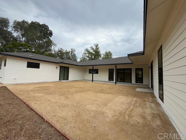 15176 Vali Hai Road Poway, CA 92064 - Photo 4 of 19 a view of a house with a yard and garage