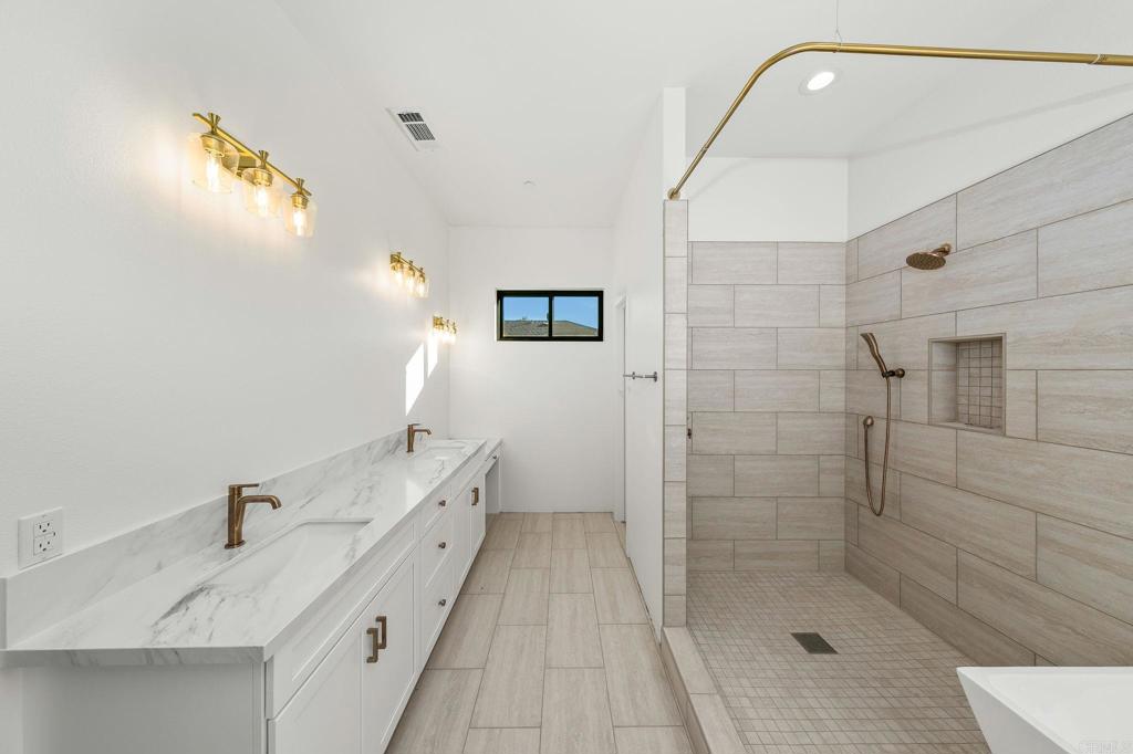 15176 Vali Hai Road Poway, CA 92064 - Photo 5 of 19 a bathroom with a sink a toilet and shower