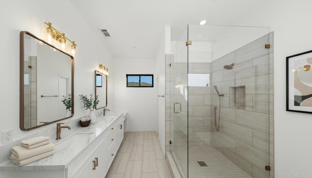 15176 Vali Hai Road Poway, CA 92064 - Photo 6 of 19 a bathroom with a double vanity sink mirror and shower