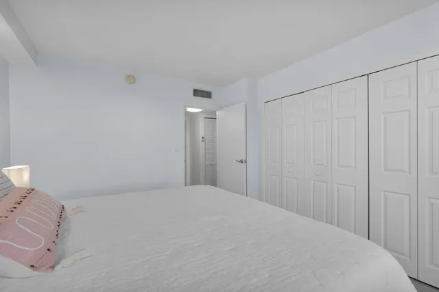 a bathroom with a bathtub shower sink vanity and toilet
