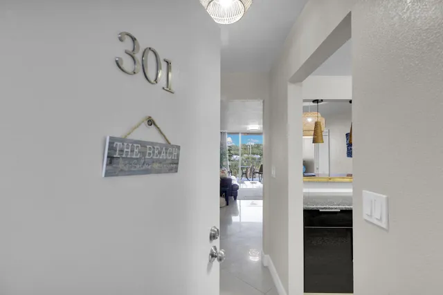 a kitchen with granite countertop a sink and a stove