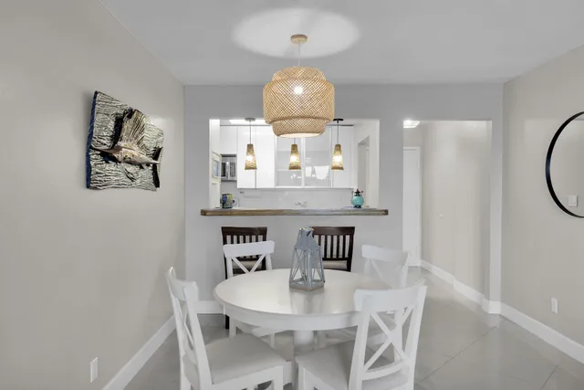a kitchen with stainless steel appliances granite countertop a sink stove and microwave