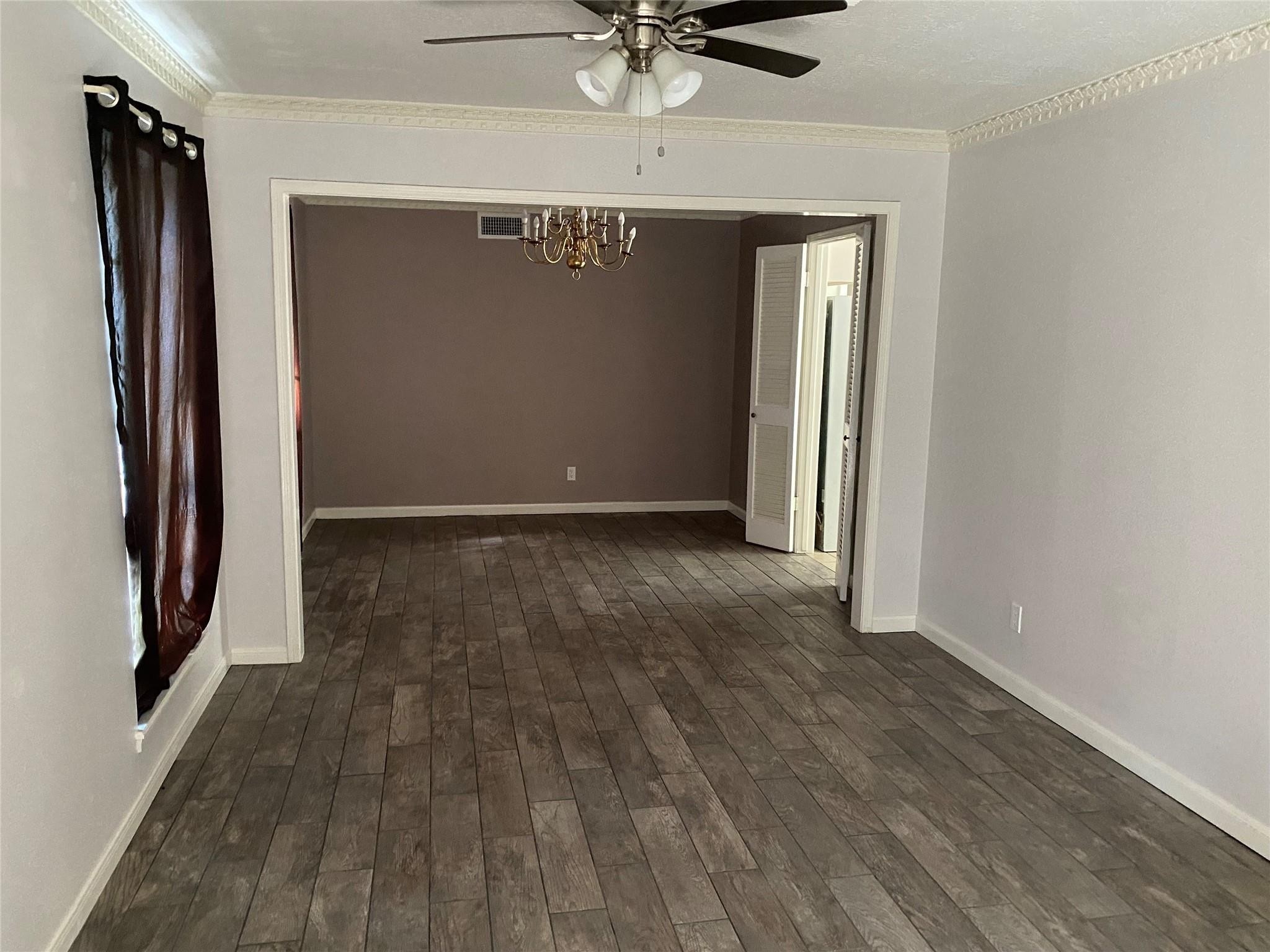 8206 Ash Valley Drive Spring, TX 77379 - Photo 3 of 8 a view of a hallway with wooden floor