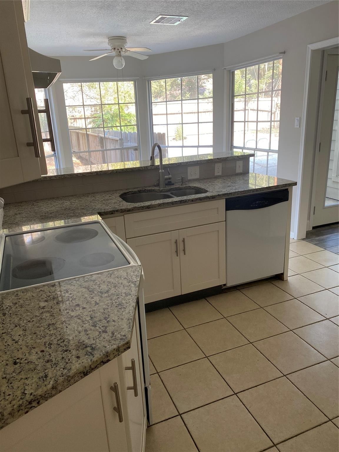 8206 Ash Valley Drive Spring, TX 77379 - Photo 6 of 8 a kitchen with stainless steel appliances granite countertop a sink and a granite counter tops