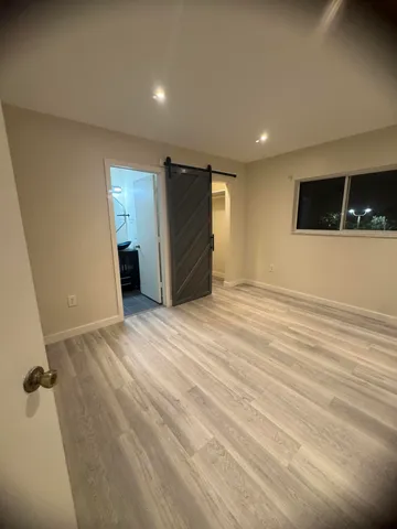 a view of an empty room with stairs
