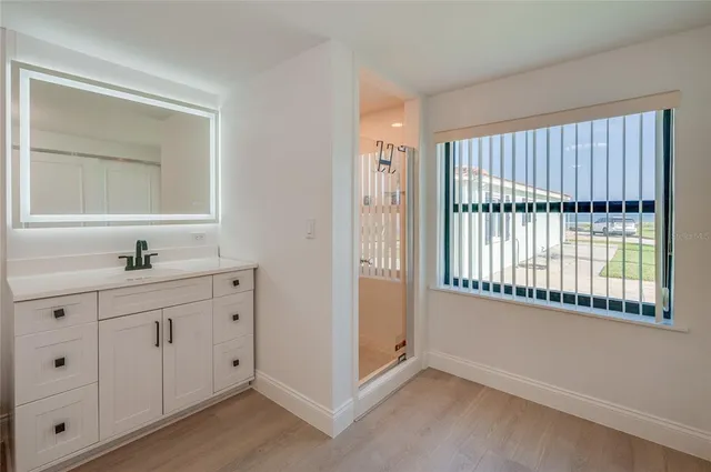 a bathroom with a sink and a mirror