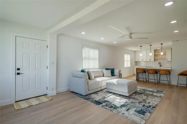 a living room with furniture and a rug