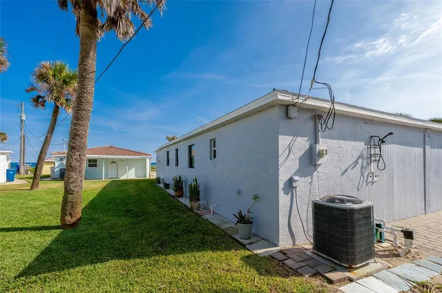 a aerial view of a house with a yard