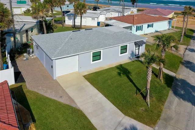 a view of a city with an ocean view