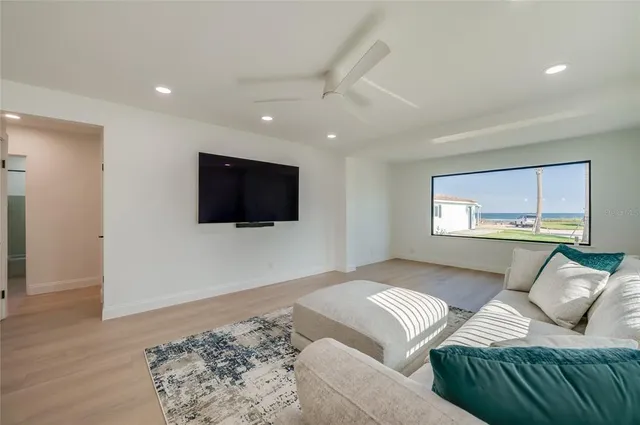a living room with a couch and a flat screen tv
