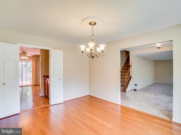9720 Ironmaster Drive Burke, VA 22015 - Photo 13 of 46 a view of a livingroom with a chandelier