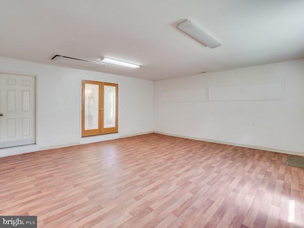 9720 Ironmaster Drive Burke, VA 22015 - Photo 17 of 46 wooden floor in an empty room with a window
