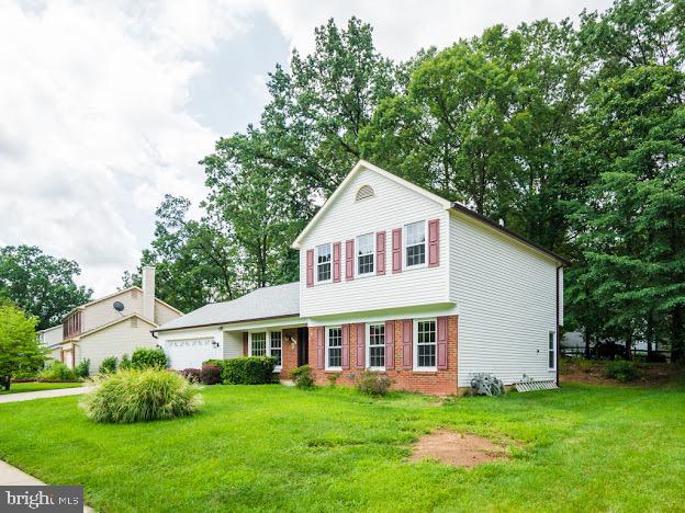 9720 Ironmaster Drive Burke, VA 22015 - Photo 2 of 46 a view of a house with a yard