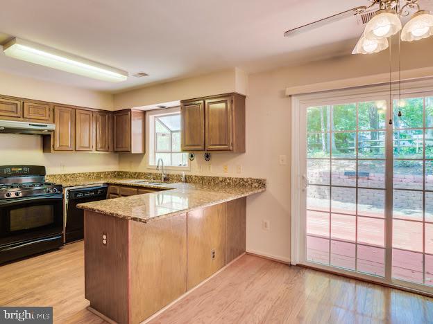 9720 Ironmaster Drive Burke, VA 22015 - Photo 23 of 46 a kitchen with stainless steel appliances granite countertop a stove a sink and a refrigerator