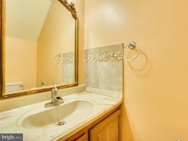 9720 Ironmaster Drive Burke, VA 22015 - Photo 31 of 46 a bathroom with a sink and a mirror