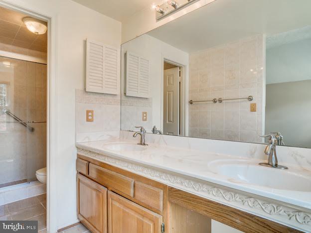 9720 Ironmaster Drive Burke, VA 22015 - Photo 37 of 46 a bathroom with a sink and a mirror
