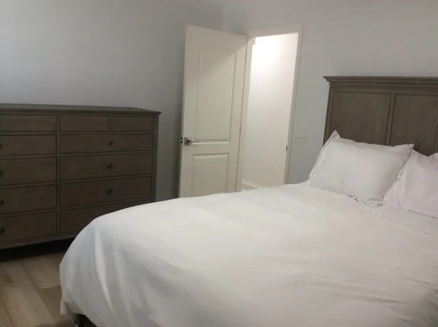a bedroom with a bed and a cabinets