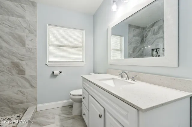 a bathroom with a sink and a toilet