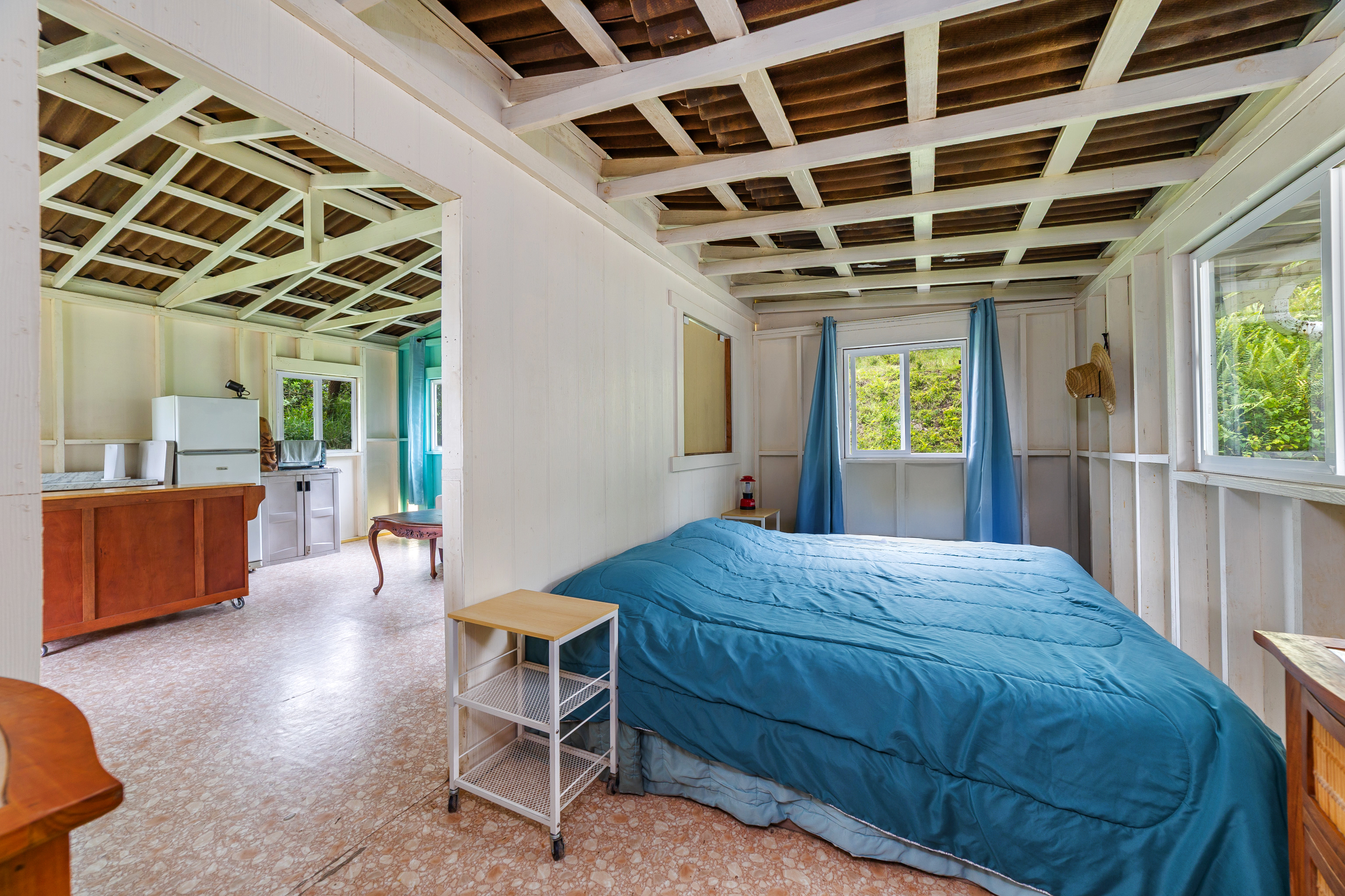 87-1081 Haleili Road Captain Cook, HI 96704 - Photo 12 of 24 a bedroom with a bed and a large window
