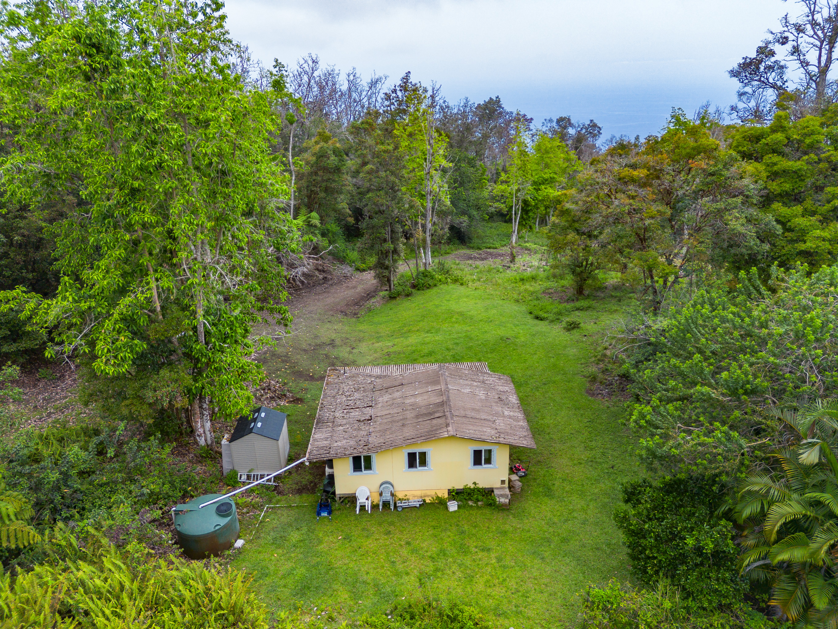 87-1081 Haleili Road Captain Cook, HI 96704 - Photo 14 of 24 a aerial view of a house with a yard and tree s