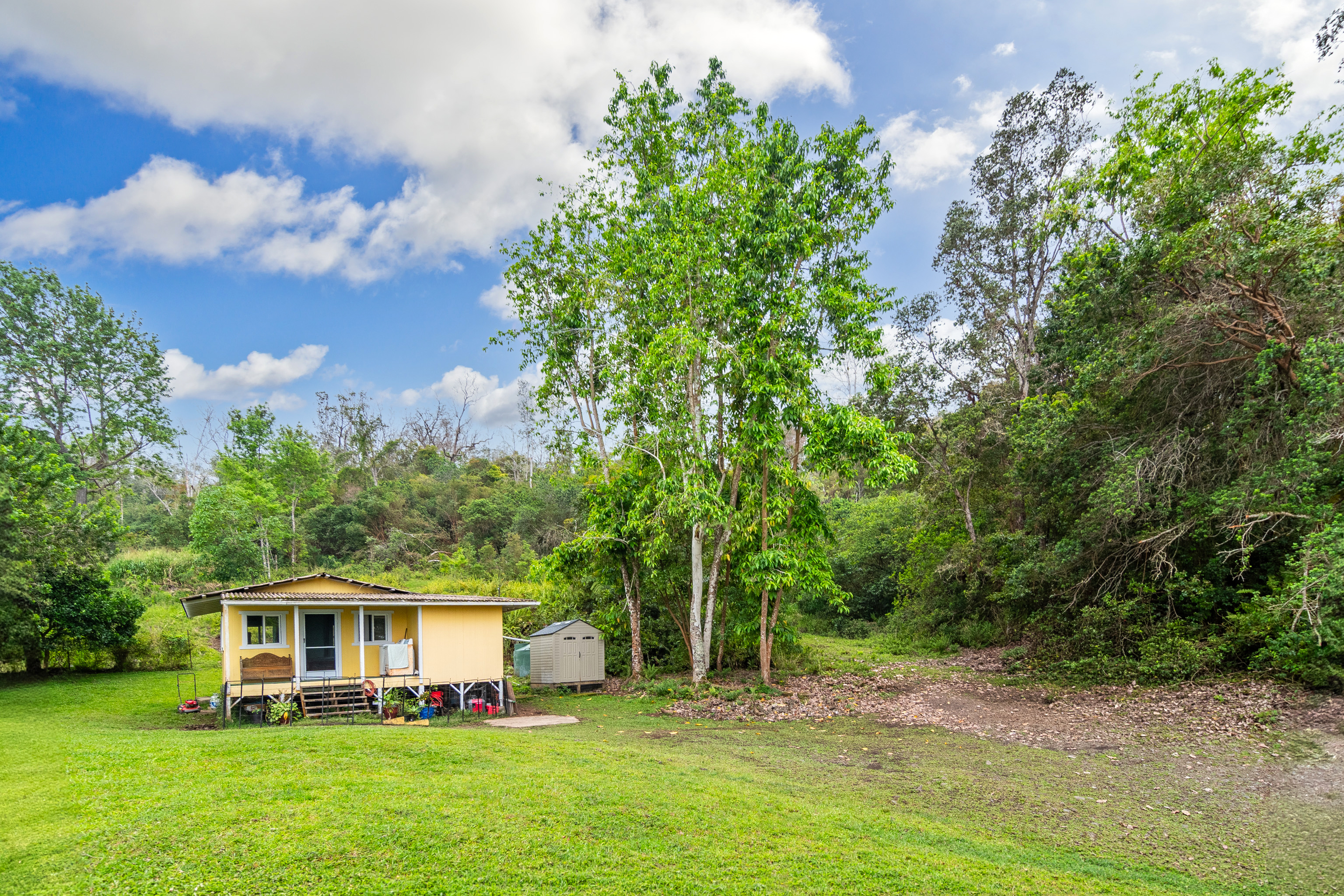 87-1081 Haleili Road Captain Cook, HI 96704 - Photo 2 of 24 a view of house with yard and entertaining space