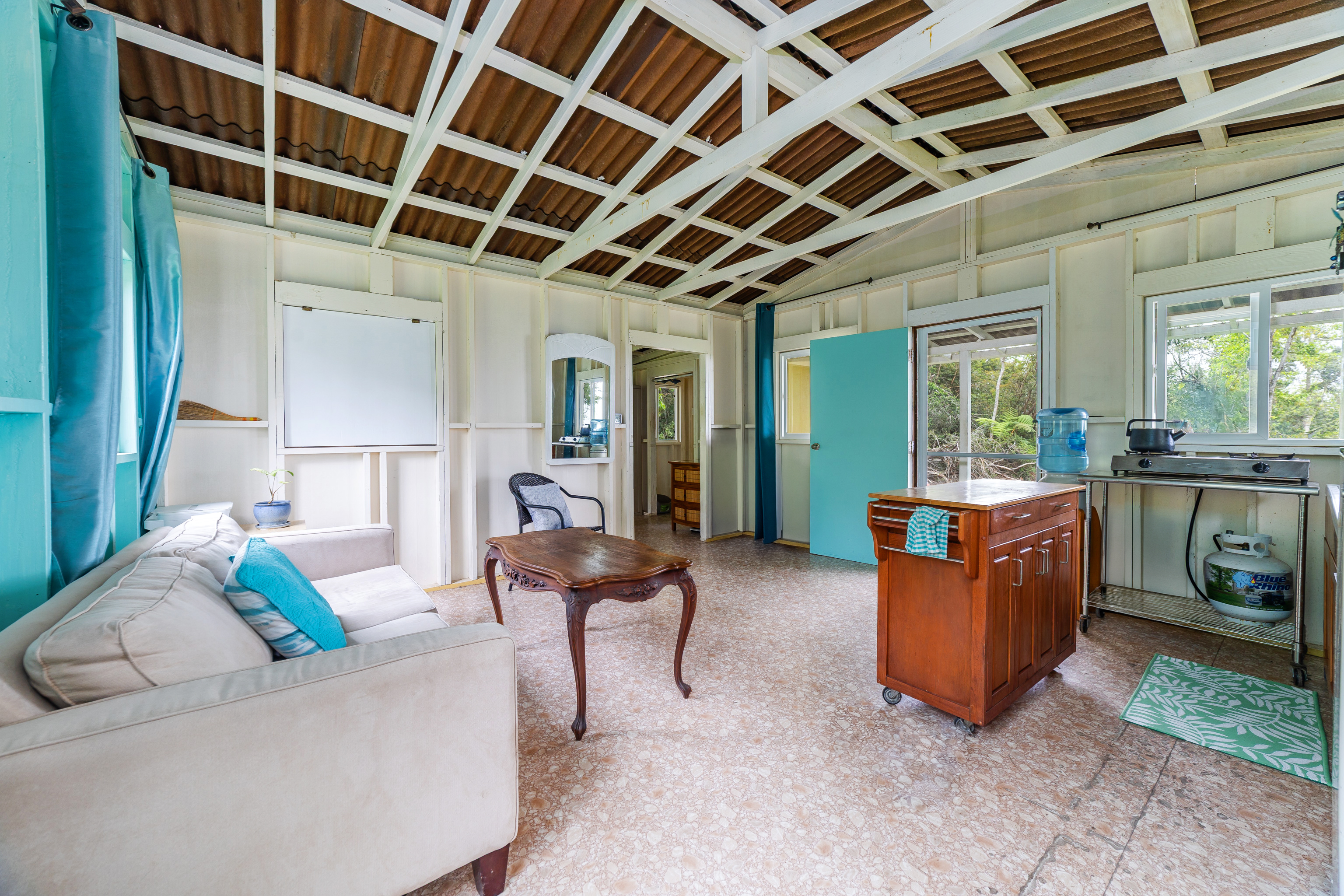 87-1081 Haleili Road Captain Cook, HI 96704 - Photo 8 of 24 a living room with furniture and a wooden floor