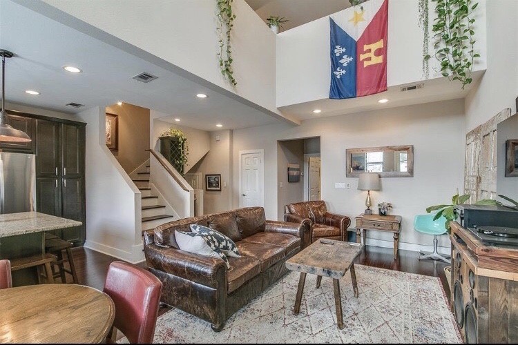 1703 Patterson Street, Unit B Houston, TX 77007 - Photo 1 of 26 a living room with furniture kitchen view and a potted plant