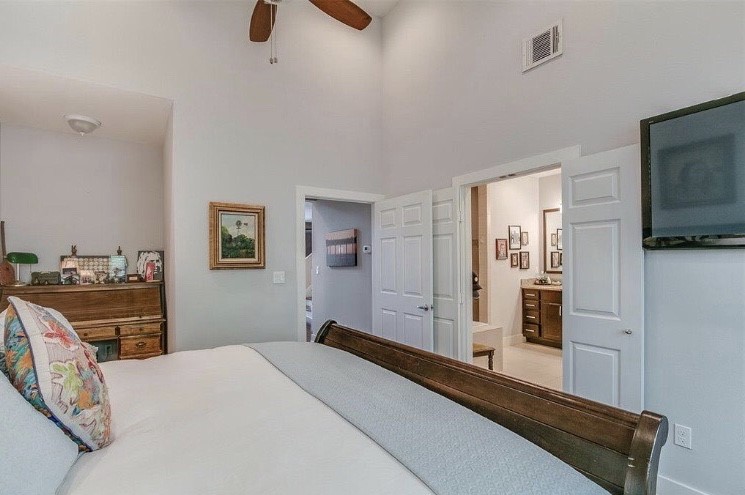 1703 Patterson Street, Unit B Houston, TX 77007 - Photo 17 of 26 a bedroom with a bed and wooden floor