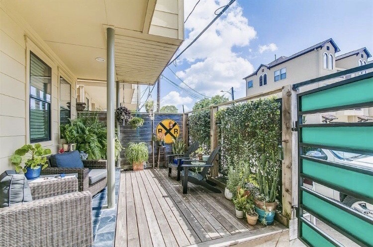 1703 Patterson Street, Unit B Houston, TX 77007 - Photo 21 of 26 a view of a balcony with chairs and a potted plant