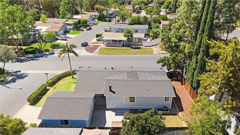 an aerial view of a house with a swimming pool