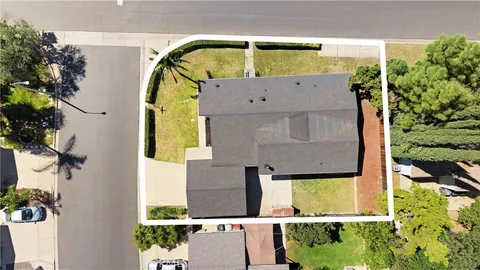 an aerial view of house with yard