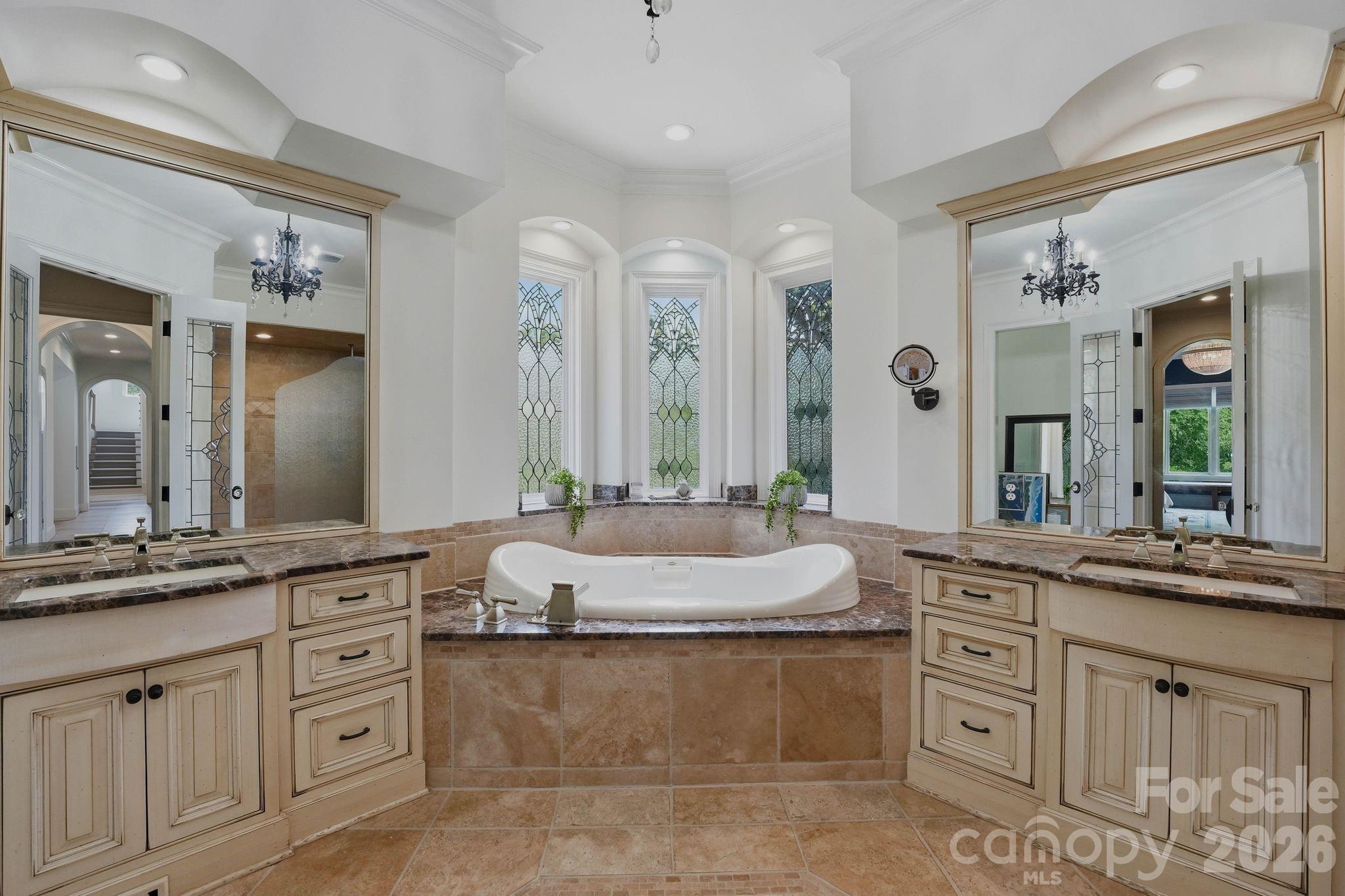 7416 Lee Rea Road Charlotte, NC 28226 - Photo 29 of 48 a spacious bathroom with a granite countertop sink mirror and a