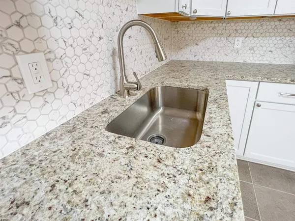 a view of storage and utility room with washer and dryer