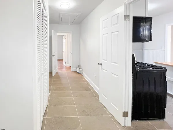 a view of a hallway with a window