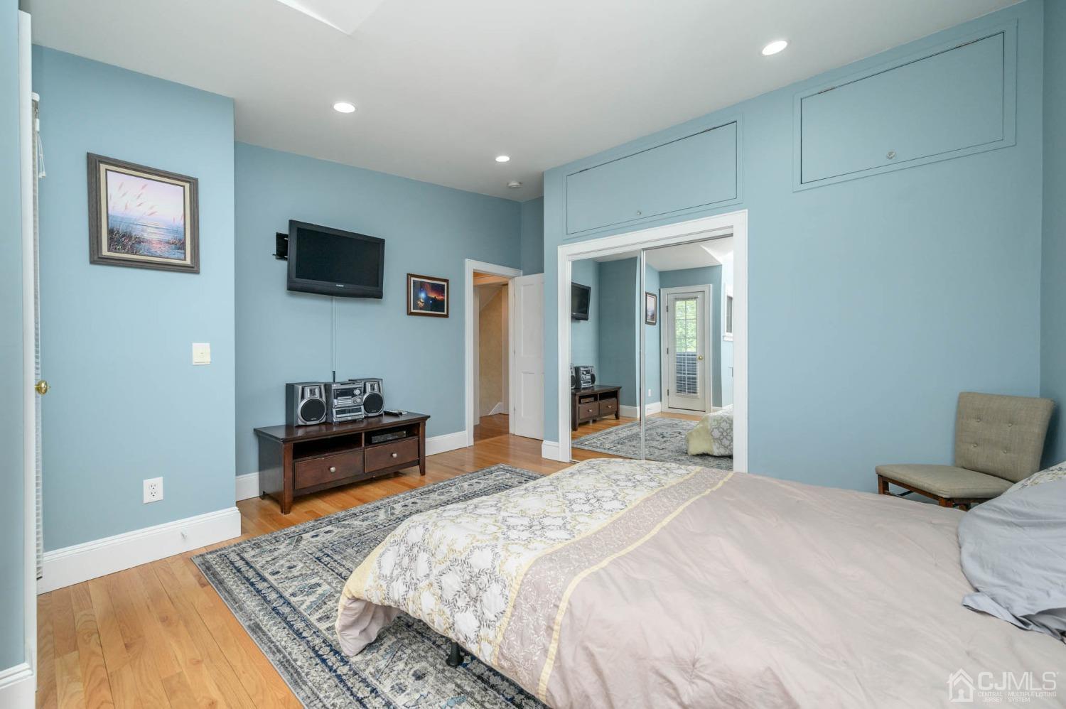 1221 Beech Avenue Mountainside, NJ 07092 - Photo 27 of 46 a bedroom with a bed and a flat screen tv