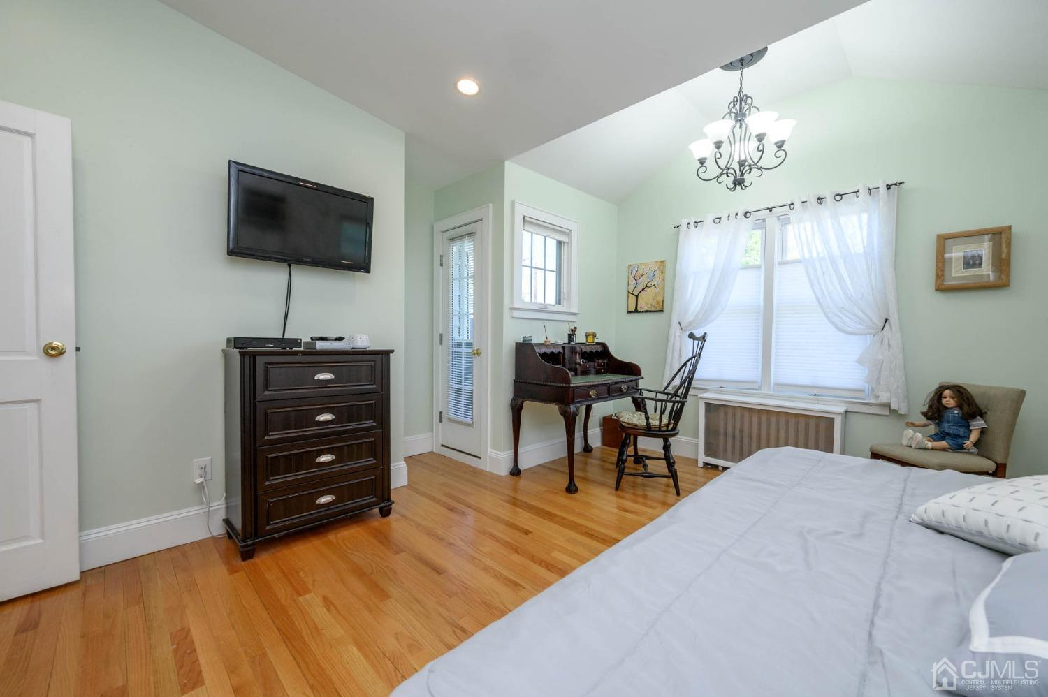 1221 Beech Avenue Mountainside, NJ 07092 - Photo 31 of 46 a bedroom with a bed and a flat screen tv