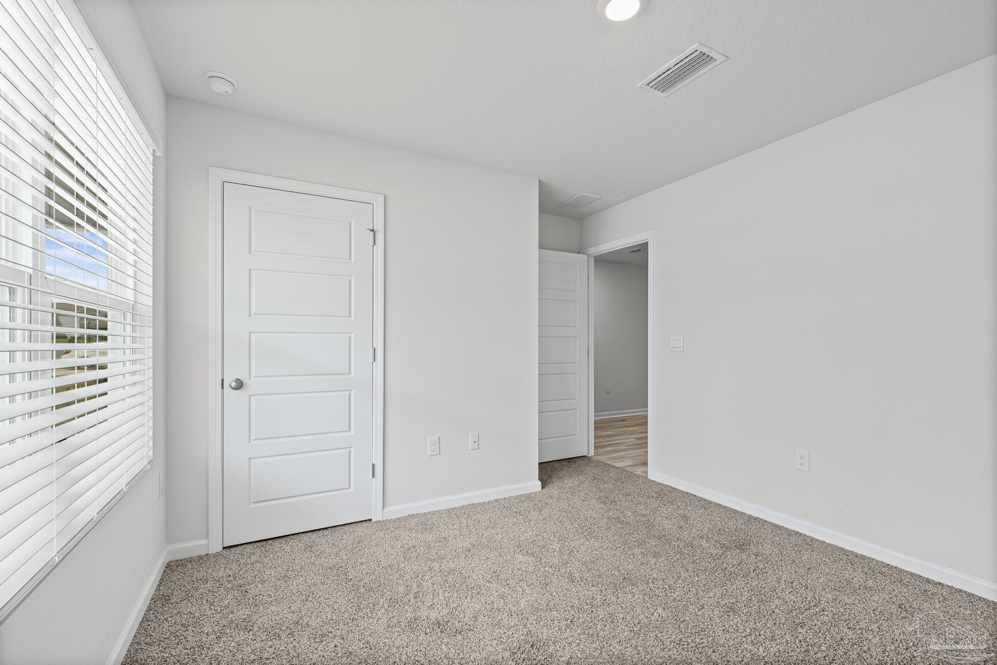 5771 Belmont Stakes Road Pensacola, FL 32526 - Photo 22 of 36 an empty room with windows